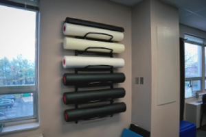 Foam rollers on a wall hack.