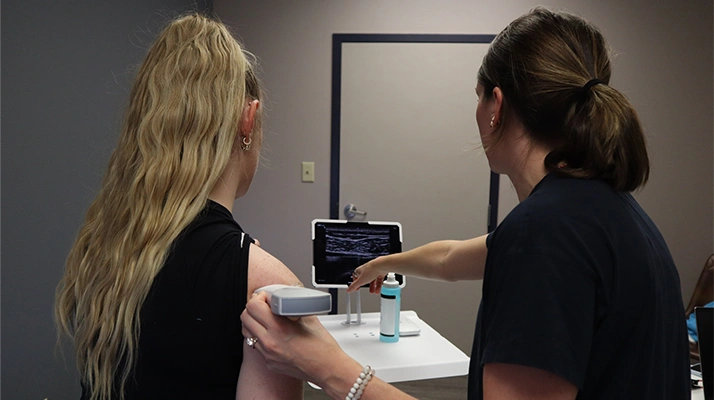 Chiropractor Towson MD Caroline Chell with patient.